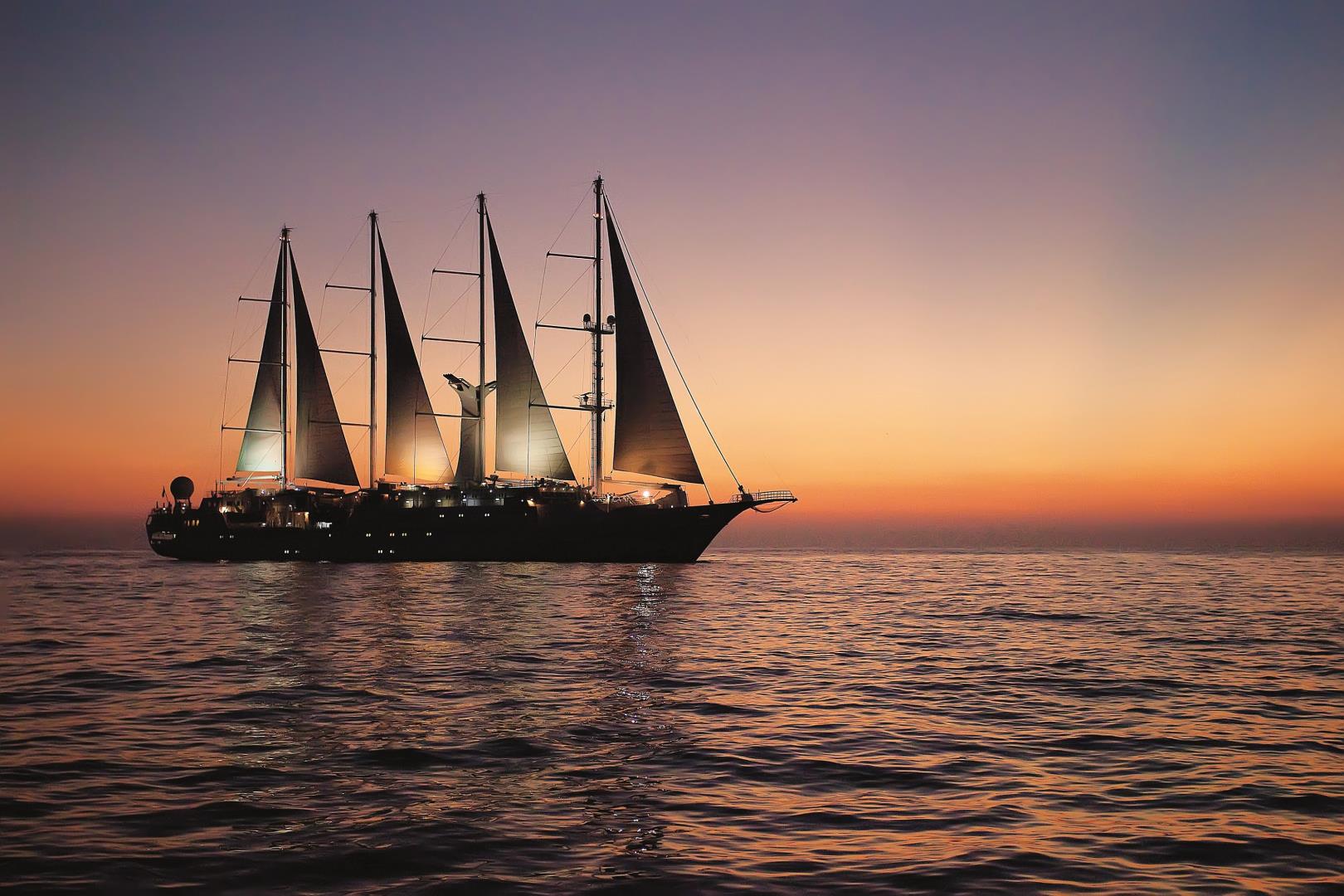 Exterior view of Wind Star sailing at sunset